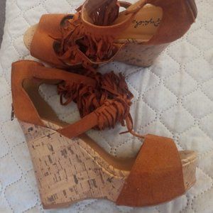 A pair of sandals I'm also selling dresses in a size medium for $20 each